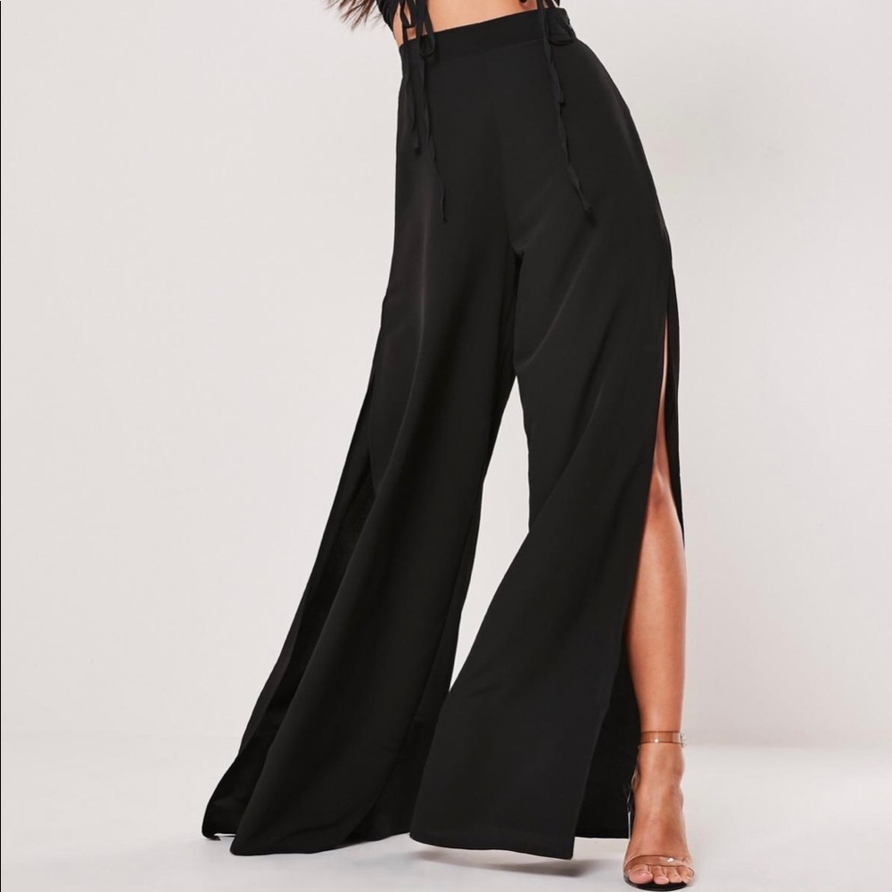 High waisted black pants with legs slits
